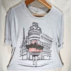 Parisian girl shopping with gems decorating the building. Size large.